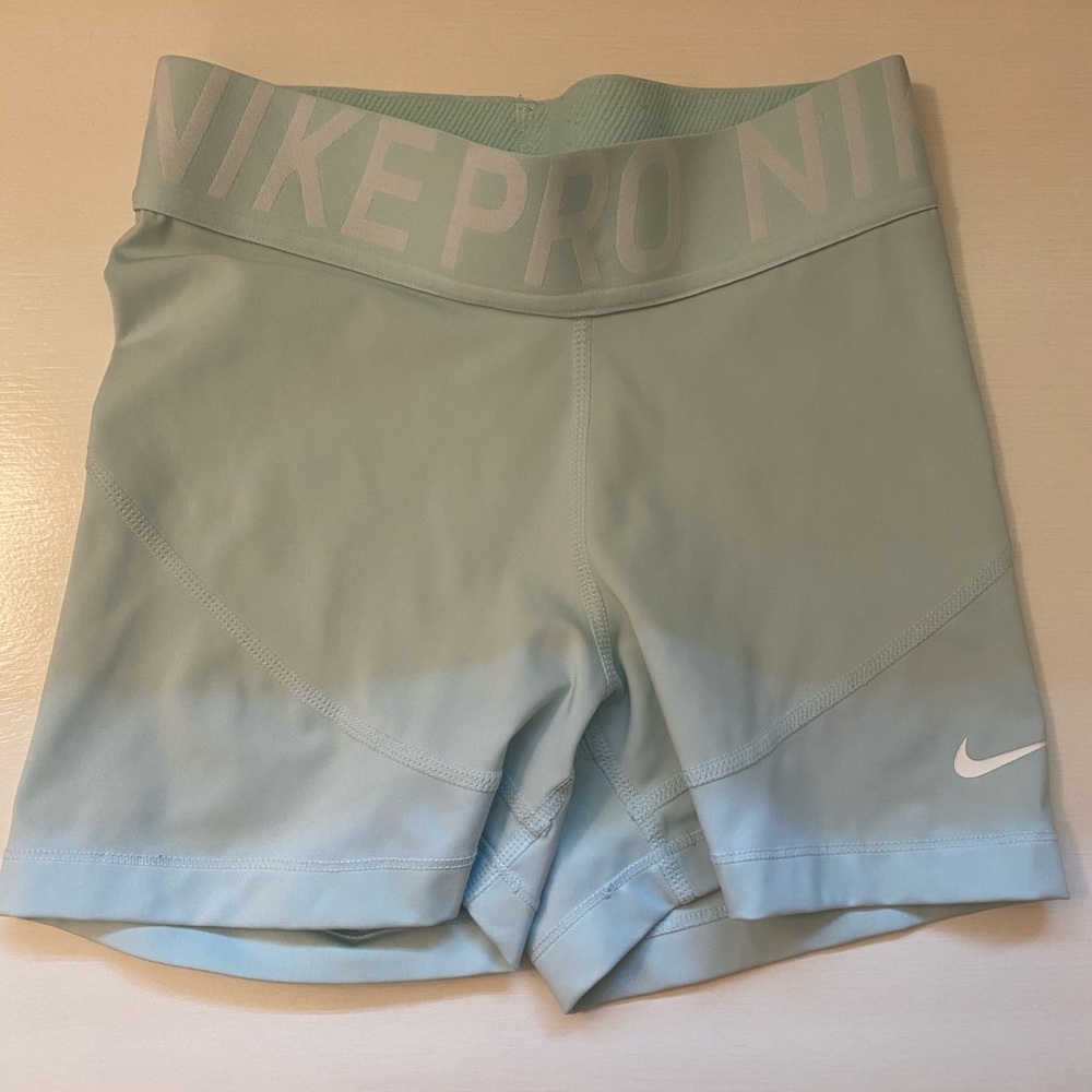 Teal Nike pros